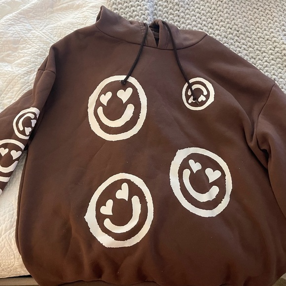 brown smiley face sweatshirt